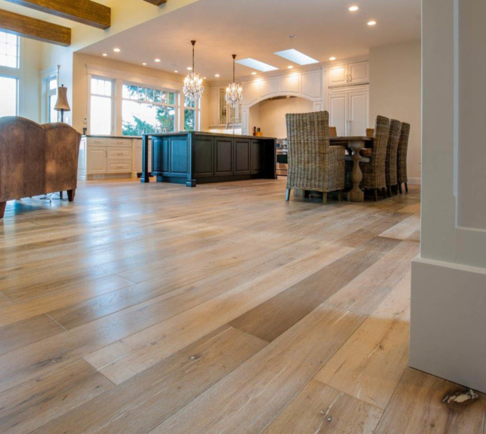 Light hardwood floors in open kitchen and dining room