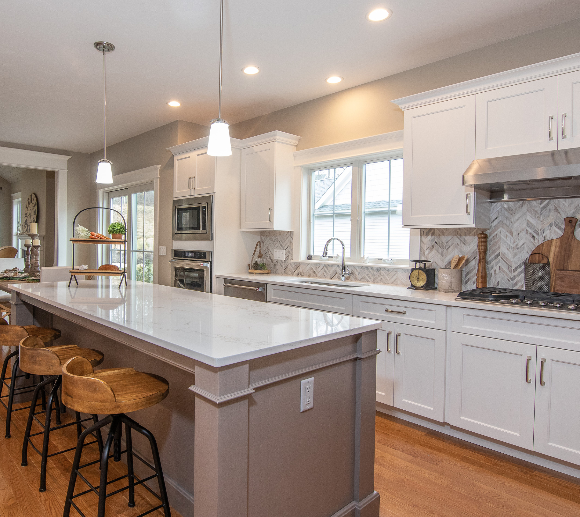 Updated kitchen white counters and white cabinets.