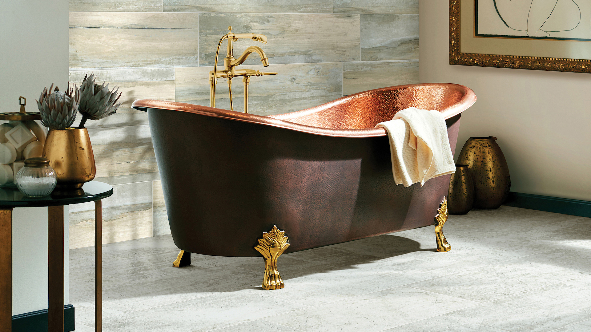 large grey bathroom tiles in an elegant bathroom with a copper tub